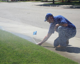 Ted, one of our Houston irrigation repair tech is checking a sprinkler head