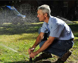 Jack, one of our Houston sprinkler repair techs is adjusting a sprinkler head